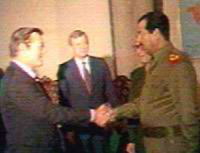Rumsfeld shaking hands with Saddam after teaching him how to use bilogical and chemical weapons. Check out IRAN/CONTRA