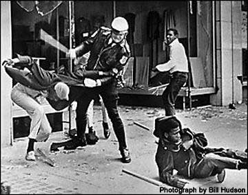 Civil Rights Photo by Bill Hudson showing peace officer clubbing an African American for no reason.