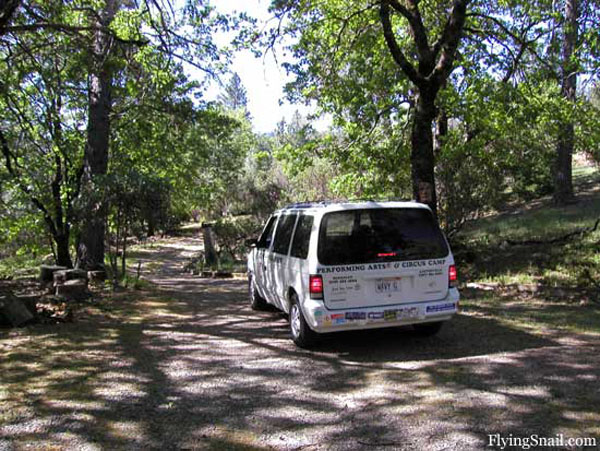 Photo of Wavy's Clownmobile departing down Flying Snail Ranch driveway