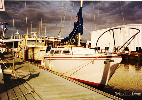 Flying Snail sitting at a doc on the bay