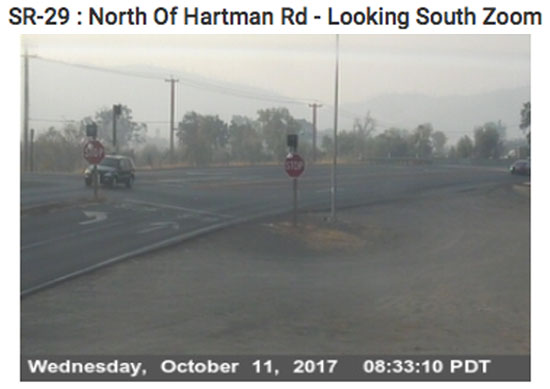 Smoke ~ local cam looking south towards mountains that have fire on the other side